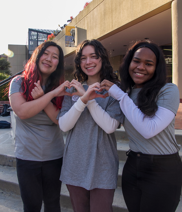 Three SHEP students smiling at camera