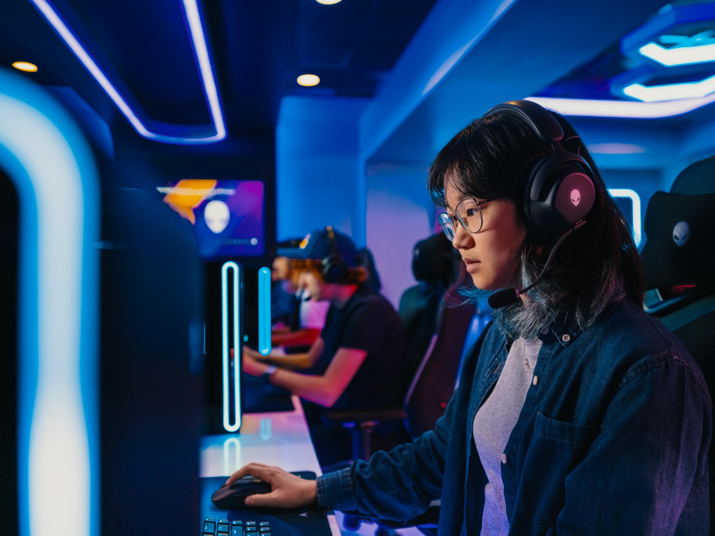 photo of students gaming inside of the Bruins Esports & Gaming Lounge Presented by Alienware