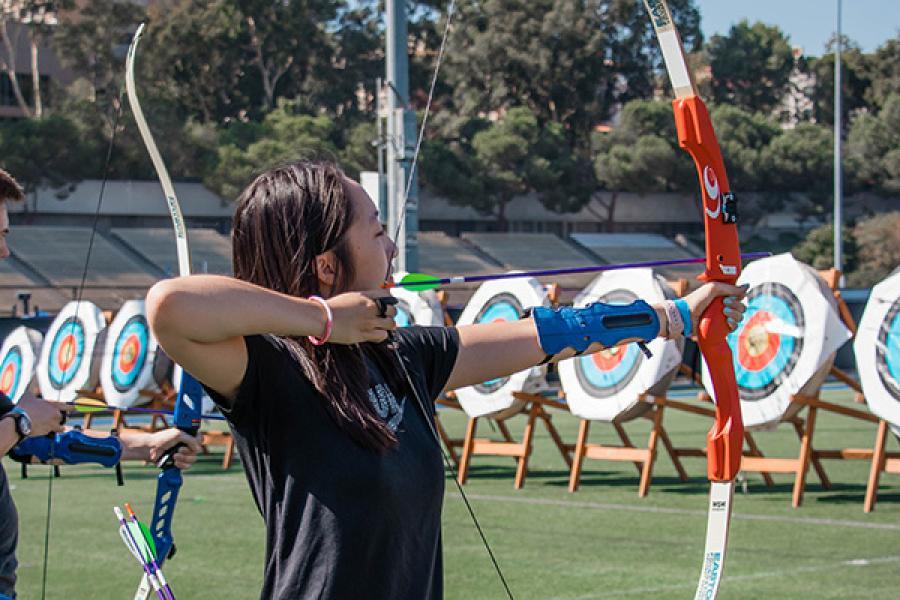 A girl playing archery
