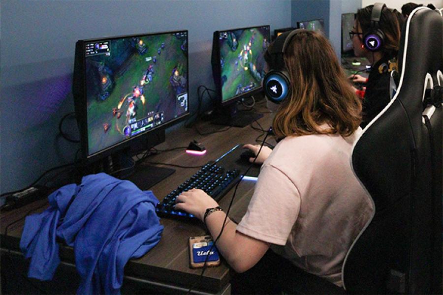 teen playing esports in esports training room