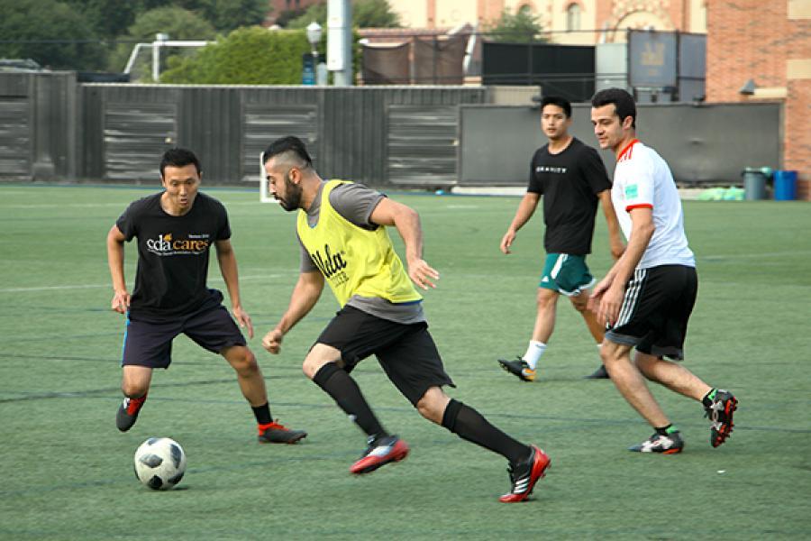 Students playing soccer game 