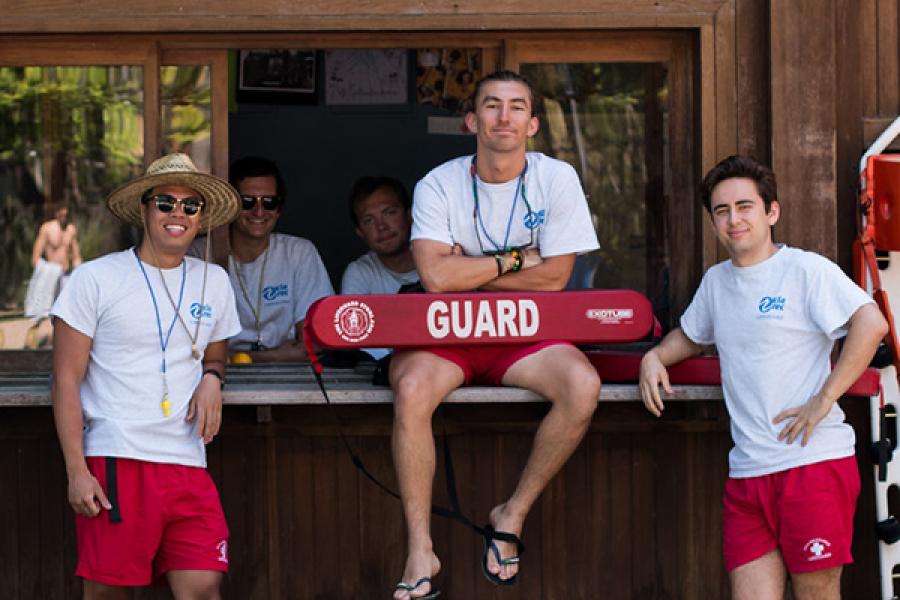 Lifeguards posing in front of office