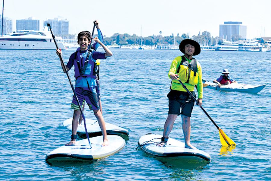two children on paddleboards