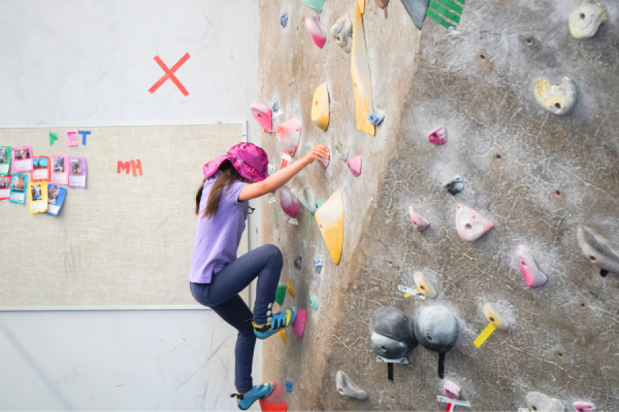 kid climbing a rock wall