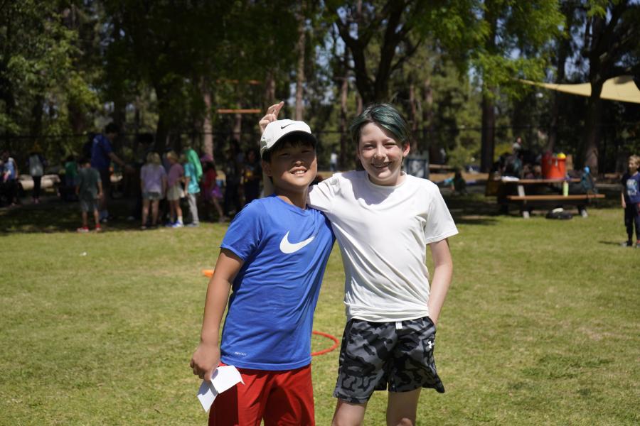 Two children smiling at camera during camp